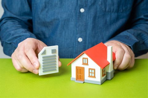 Man with house and deed
