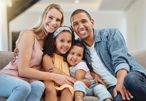 Diverse family of mom, dad, and two daughters
