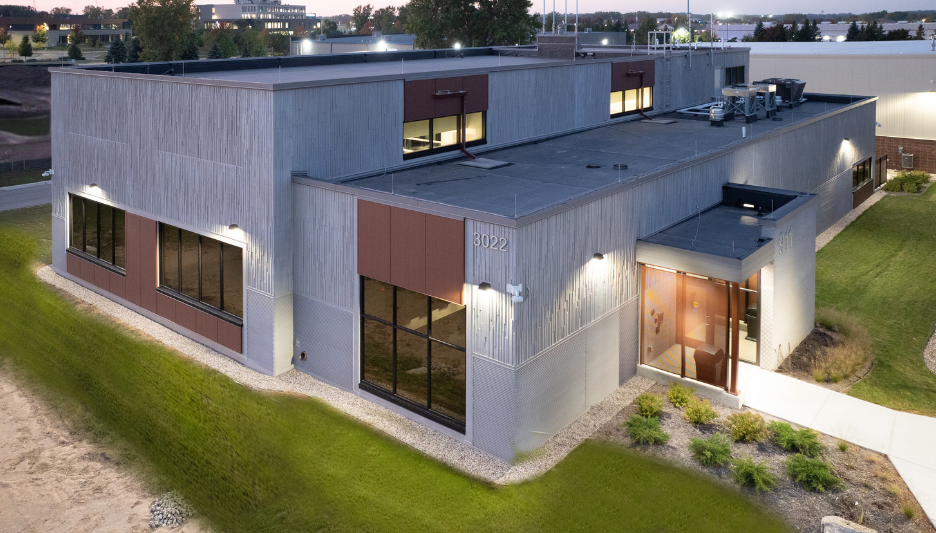 View of communications center exterior at dusk.