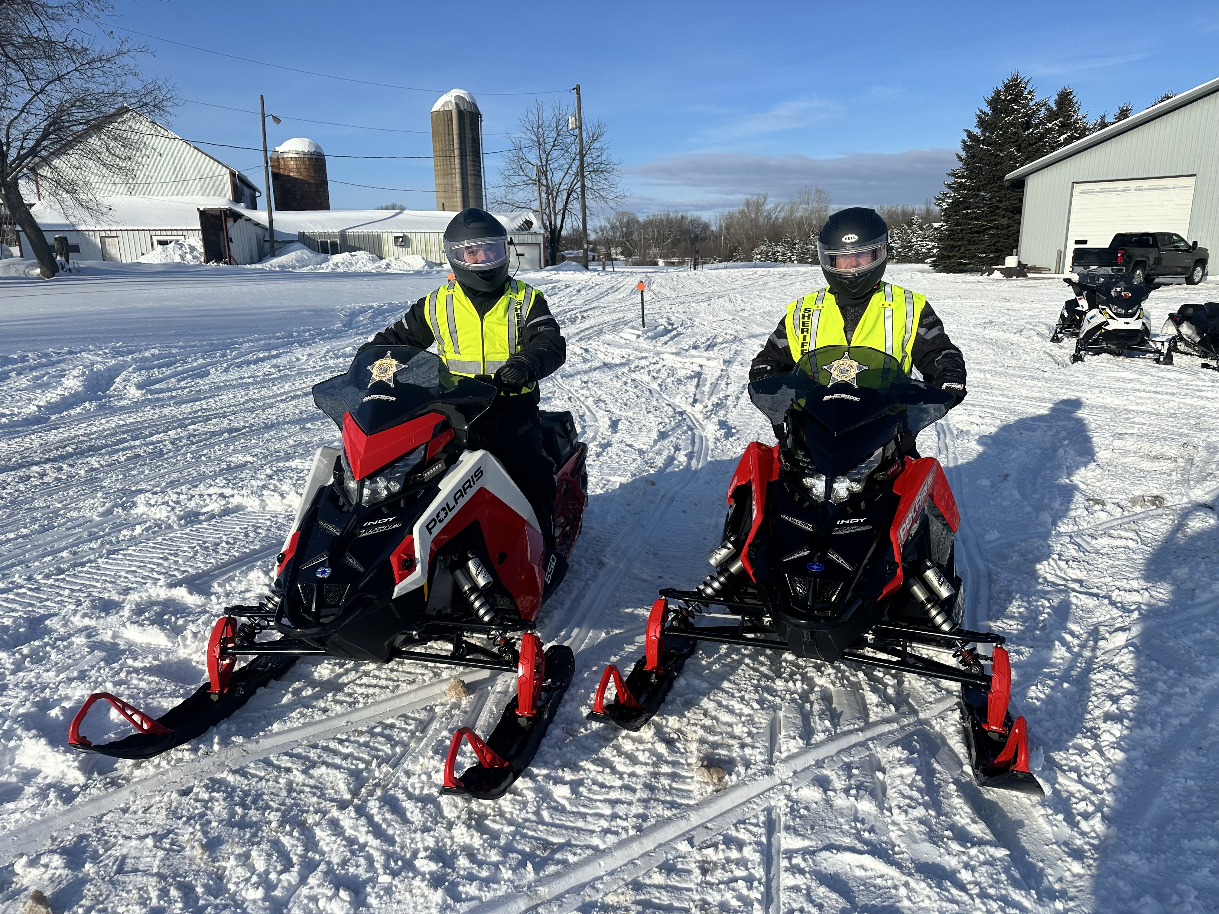 Two Sheriff's Office snowmobile patrol deputies on snowmobiles