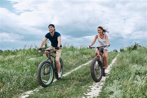 Couple riding on fat tire bikes