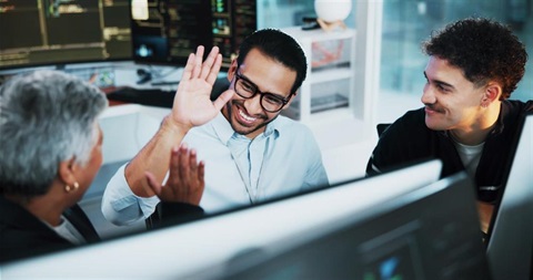 tech support employees happy for new website launch