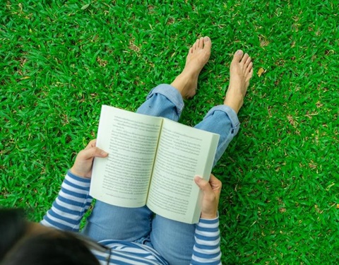 Woman sitting reading book